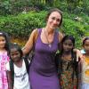 ACT executive director Lisa Kohomban and her daughter with estate children during a 2011 site visit. 